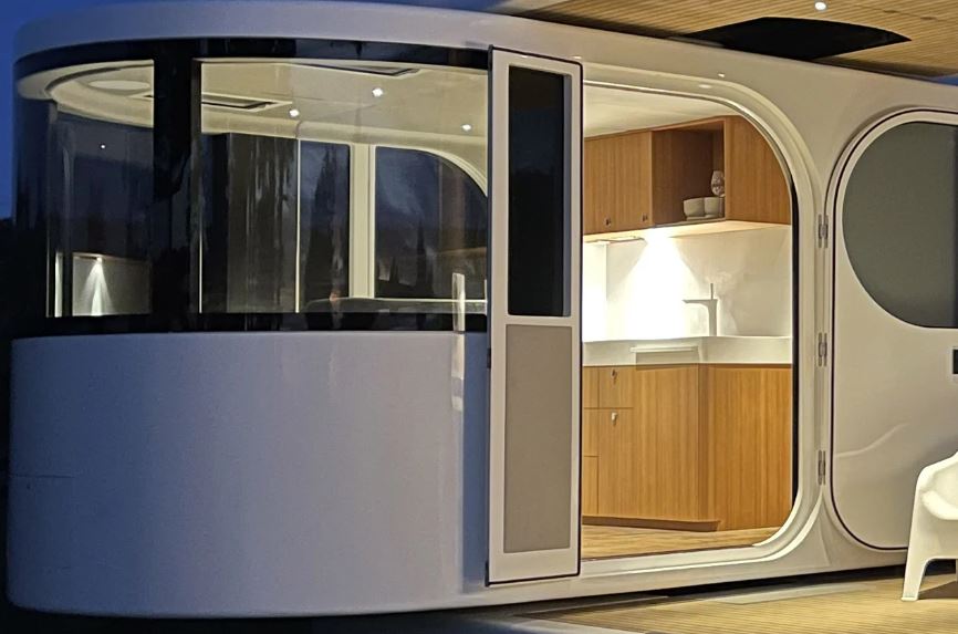 THIS TRAVEL TRAILER SWIVELS 90DEGREES TO TRANSFORM FROM CLOSED CABIN INTO OPEN LIVING TINY HOME - 10934